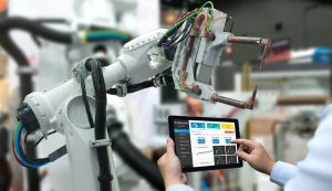Robot arm and tablet used in manufacturing